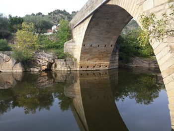 Arch bridge over river