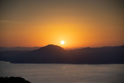 Scenic view of mountains against sky during sunset