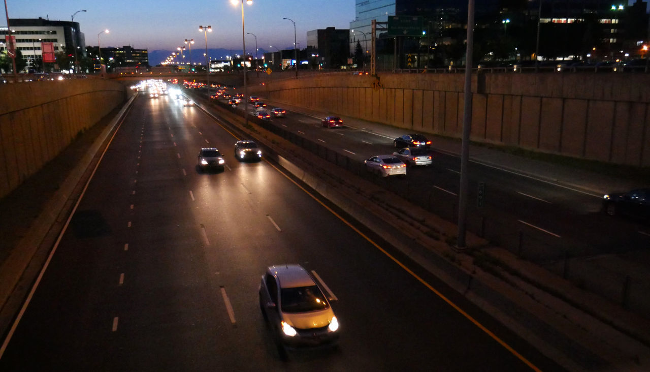 HIGH ANGLE VIEW OF VEHICLES ON ROAD AT NIGHT