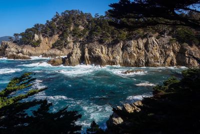 Scenic view of sea against clear blue sky