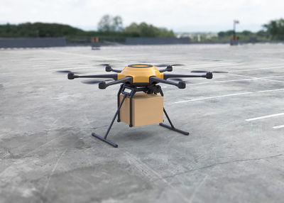 Close-up of yellow cart on floor