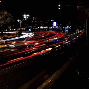 Light trails on road in city at night