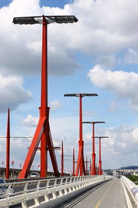 Crane in city against sky