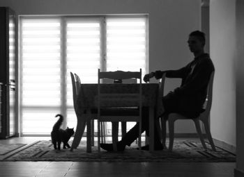 People sitting on chair in corridor