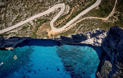 High angle view of rocks by sea