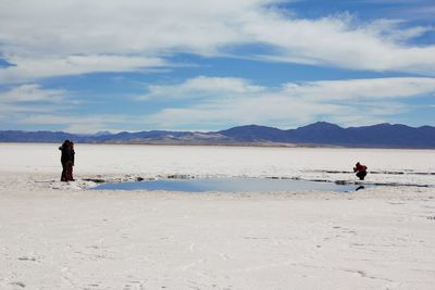 Man on beach against sky