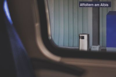 Garbage can seen through train window