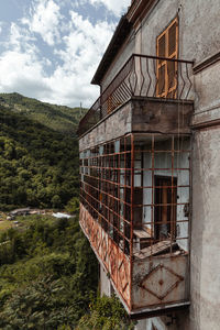 Low angle view of abandoned building against sky