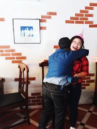 Young couple standing at home