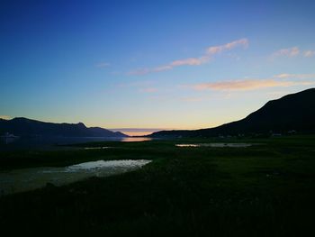 Scenic view of landscape against sky during sunset