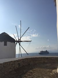 Sailboat by sea against sky