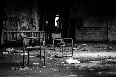 Empty chairs in abandoned building