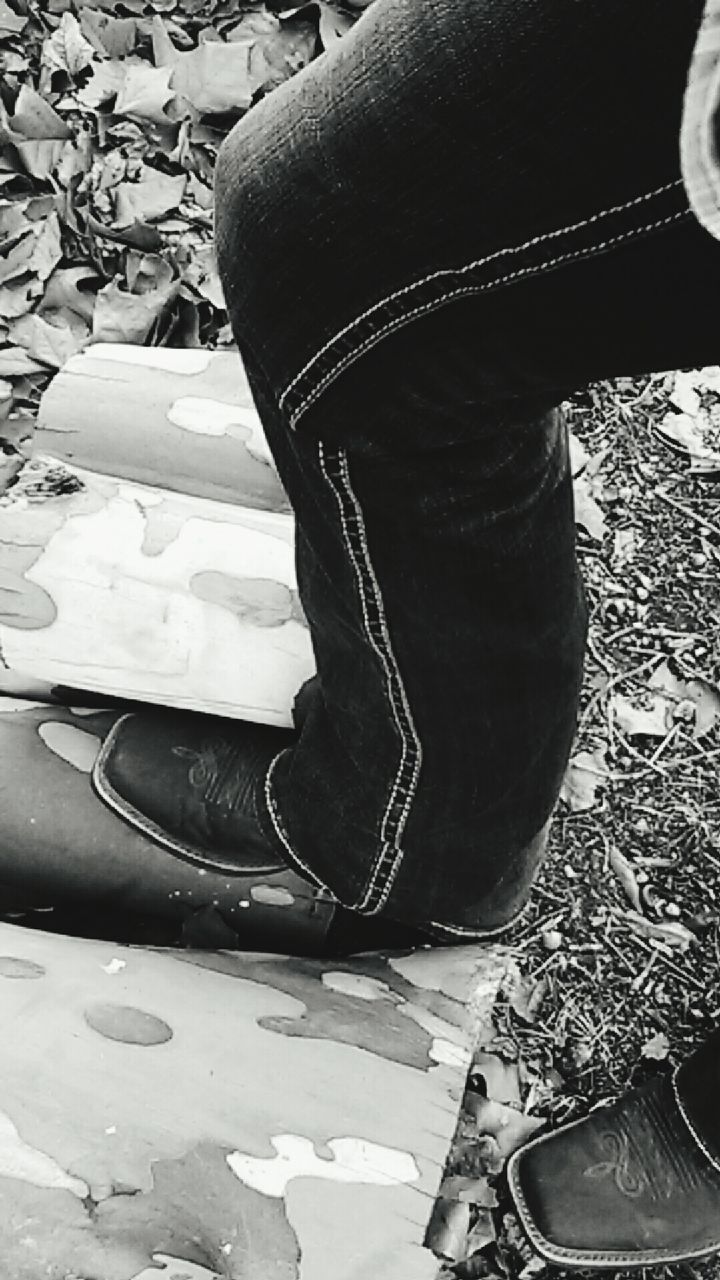 CLOSE-UP LOW SECTION OF WOMAN STANDING ON FLOOR