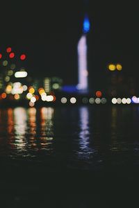 Reflection of illuminated lights in water at night