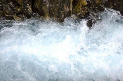 Waves splashing on rocks