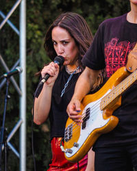 Young woman playing guitar