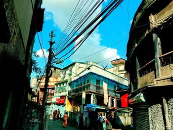 Low angle view of buildings in city against sky