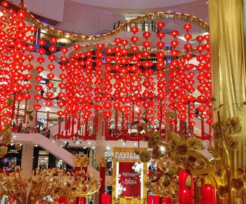 Low angle view of illuminated lanterns hanging on ceiling