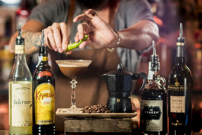 Midsection of man preparing food