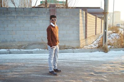 Portrait of boy standing in snow