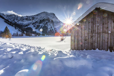 Scenic view of snowcapped mountains against sky during winter