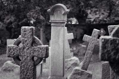 Close-up of cross on cemetery