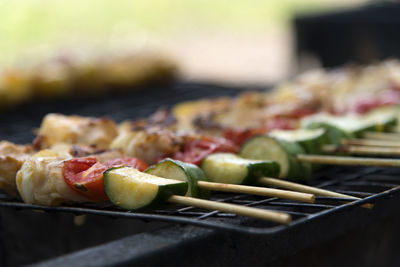 Close-up of meat and vegetables on barbecue grill