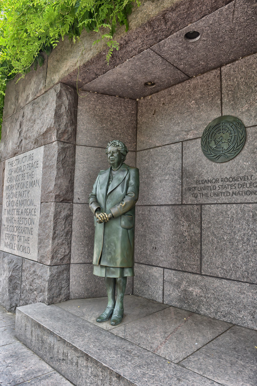 STATUE ON WALL