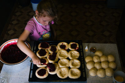 High angle view of girl having fruits