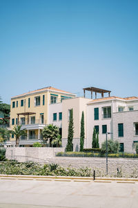 Built structures against clear blue sky