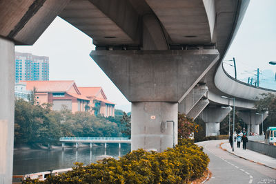 Low angle view of bridge in city