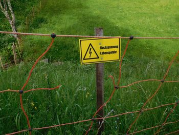 Road sign on green grass