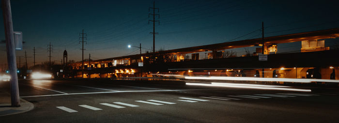 Light trails on road in city at night