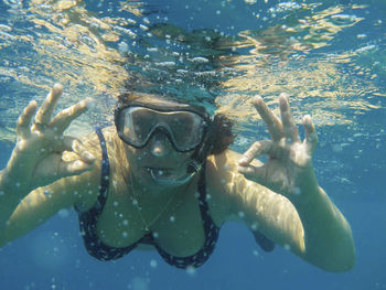 Portrait of man swimming in sea