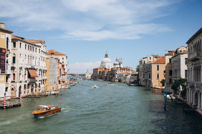 Boats in canal in city