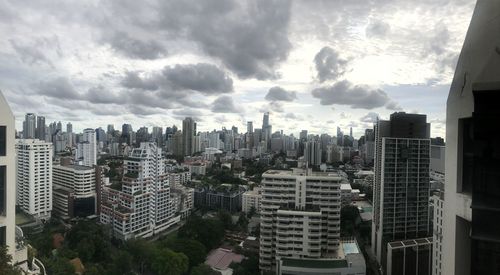 High angle view of modern buildings in city against sky