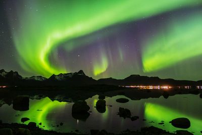 Scenic view of landscape against sky at night