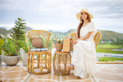 Rear view of a woman standing by basket