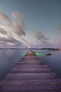 Long jetty leading to calm sea