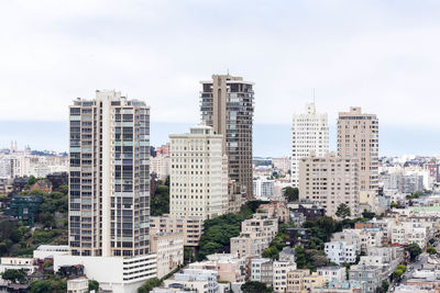 Buildings in city against sky