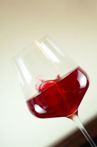 Close-up of red object over white background