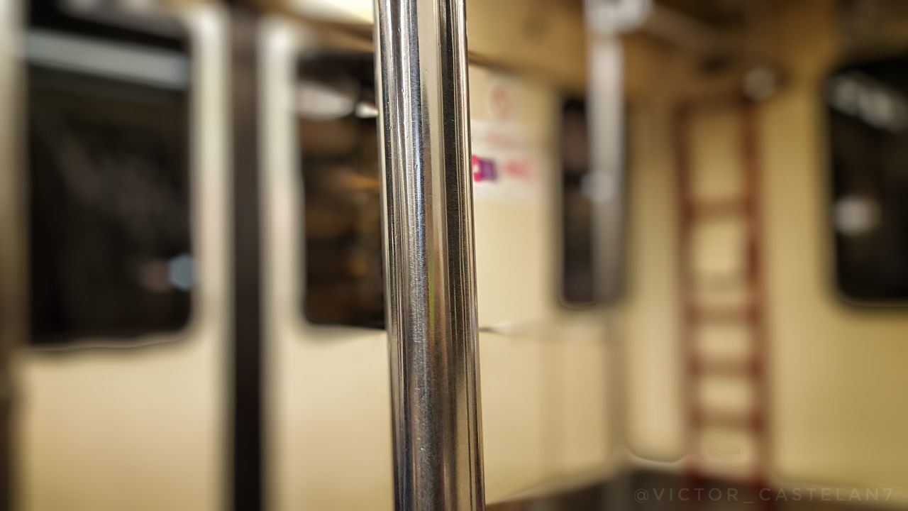 CLOSE-UP OF TRAIN AGAINST WINDOW IN RAILROAD STATION