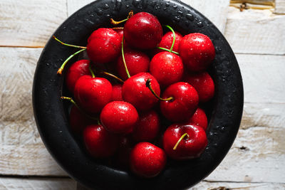 High angle view of strawberries in bowl on table