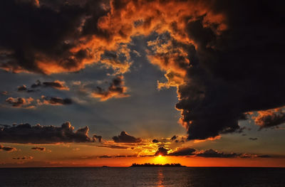 Dramatic sky over sea during sunset