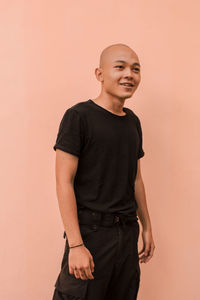 Portrait of young man against white background