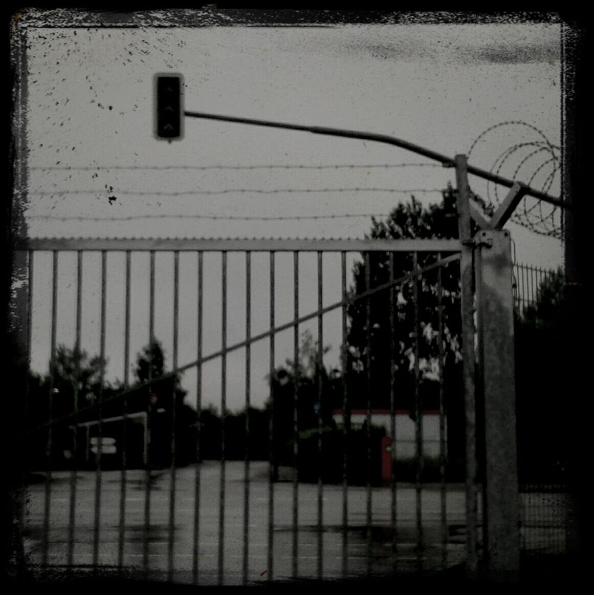 transfer print, built structure, architecture, auto post production filter, building exterior, fence, railing, metal, sky, chainlink fence, protection, safety, security, clear sky, outdoors, city, day, silhouette, low angle view, no people