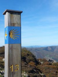 Built structure on wooden post against sky