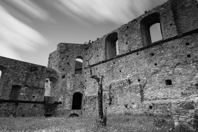 Low angle view of old ruin against sky