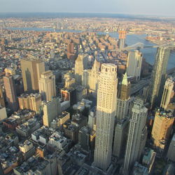 Aerial view of buildings in city against sky