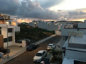 High angle view of buildings against sky during sunset